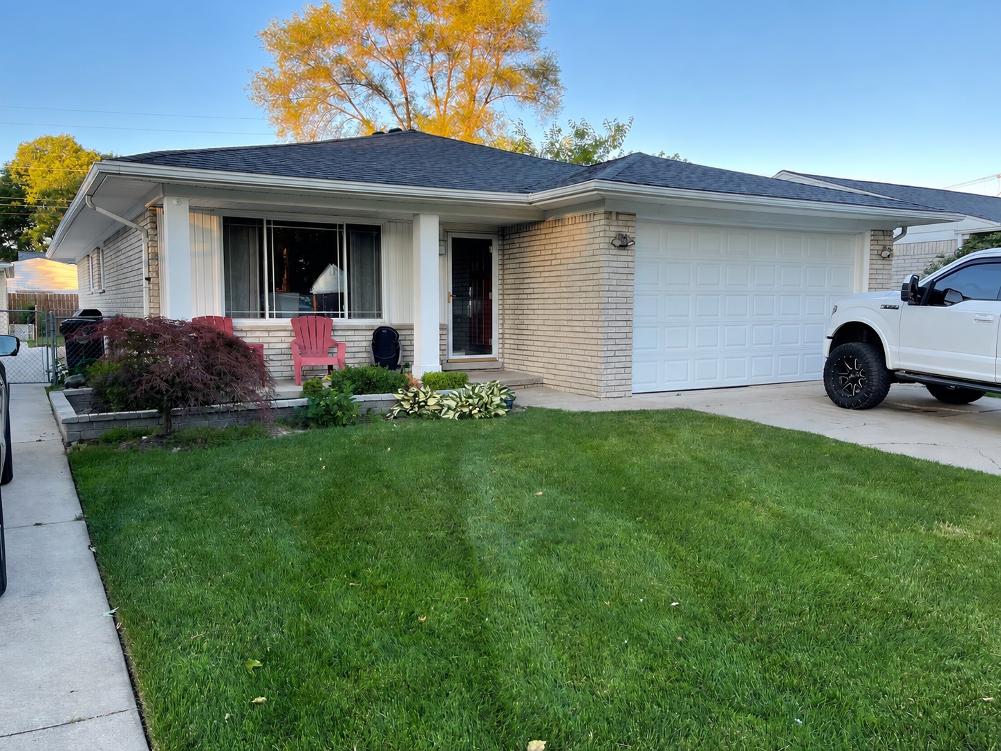 Brick and siding exterior before a whole-home painting project
